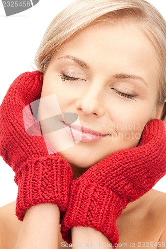 Image of beautiful woman in mittens