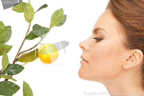 Image of lovely woman with lemon twig