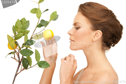 Image of lovely woman with lemon twig