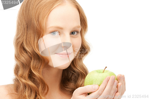 Image of young beautiful woman with green apple