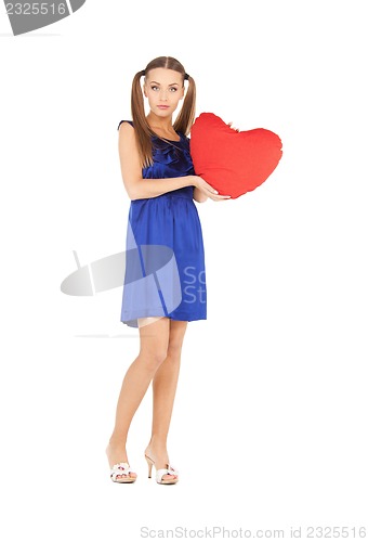 Image of lovely woman with red heart-shaped pillow