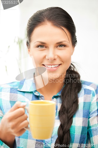 Image of lovely housewife with mug