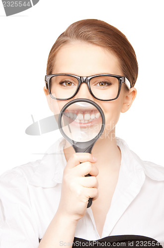 Image of woman with magnifying glass showing teeth