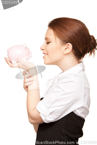 Image of lovely woman with piggy bank