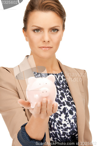 Image of lovely woman with piggy bank