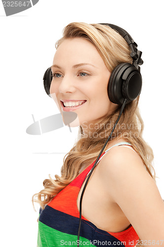 Image of happy teenage girl in big headphones