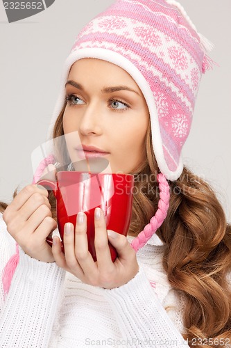 Image of woman with red mug