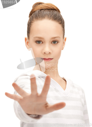 Image of teenage girl making stop gesture