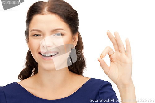 Image of lovely teenage girl showing ok sign