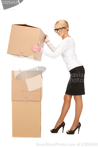 Image of attractive businesswoman with big boxes