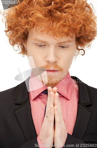 Image of praying businessman