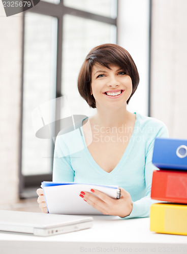 Image of woman with folders