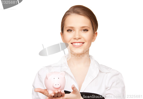 Image of lovely woman with piggy bank