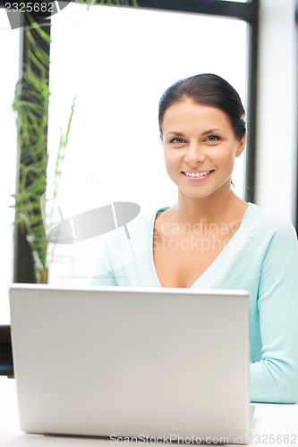 Image of happy woman with laptop computer