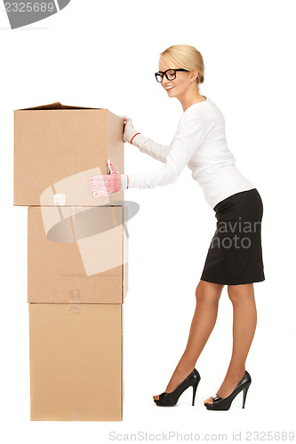 Image of attractive businesswoman with big boxes