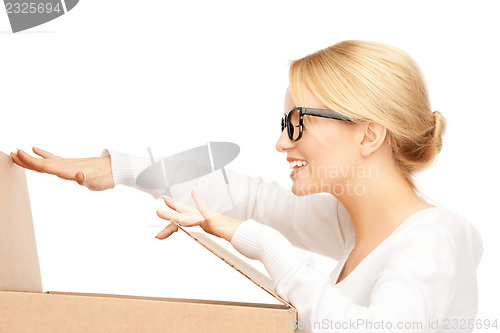 Image of attractive businesswoman with cardboard box