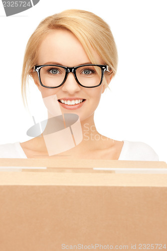 Image of attractive businesswoman with cardboard box