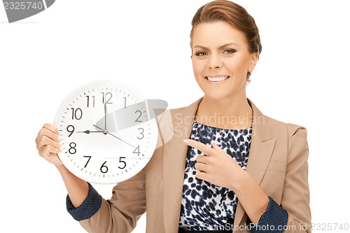 Image of woman holding big clock