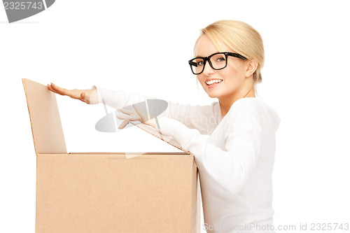 Image of attractive businesswoman with cardboard box