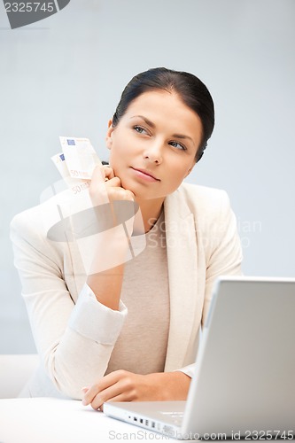 Image of lovely woman with euro cash money