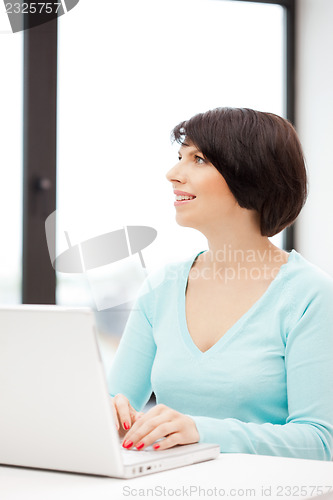 Image of happy woman with laptop computer