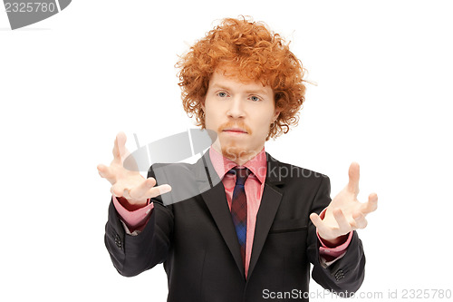 Image of businessman working with something imaginary