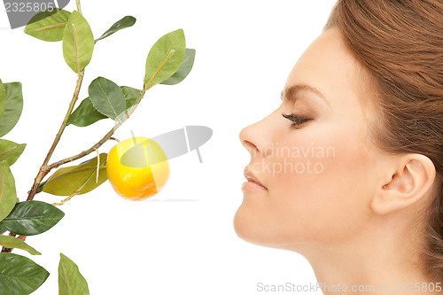 Image of lovely woman with lemon twig