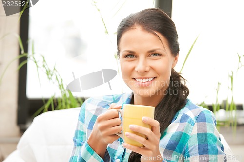 Image of lovely housewife with mug