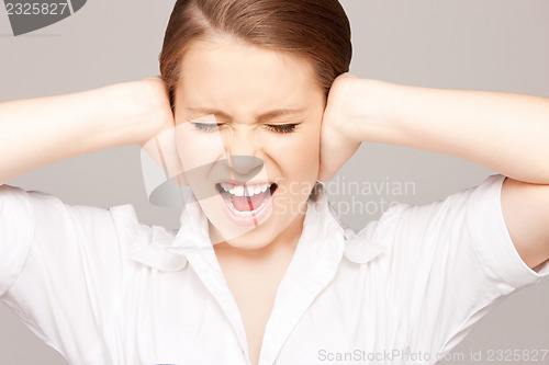 Image of woman with hands on ears