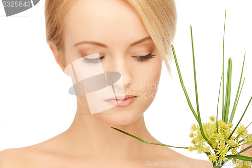 Image of woman with green sprout