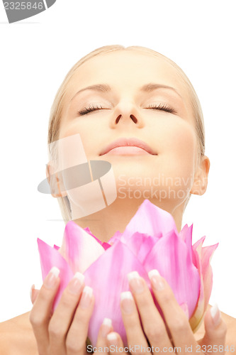 Image of beautiful woman with lotus flower