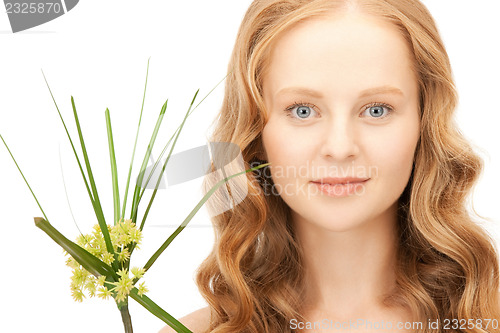 Image of woman with green sprout