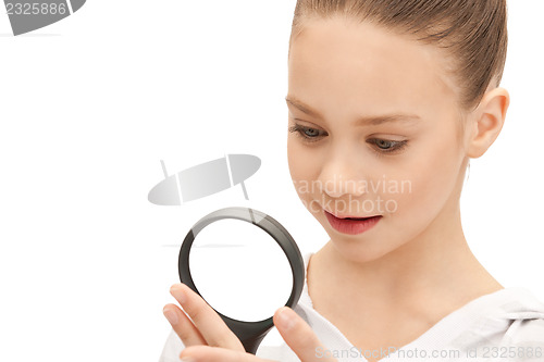 Image of teenage girl with magnifying glass