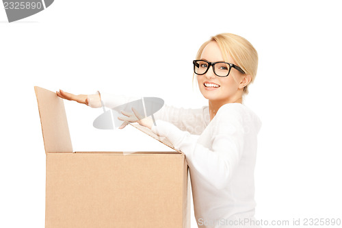 Image of attractive businesswoman with cardboard box