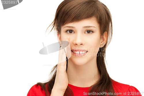 Image of teenage girl whispering gossip