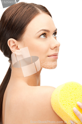 Image of beautiful woman with sponge