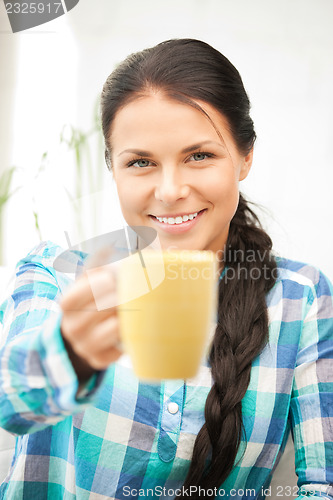 Image of lovely housewife with mug