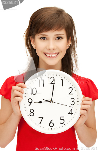 Image of teenage girl holding big clock