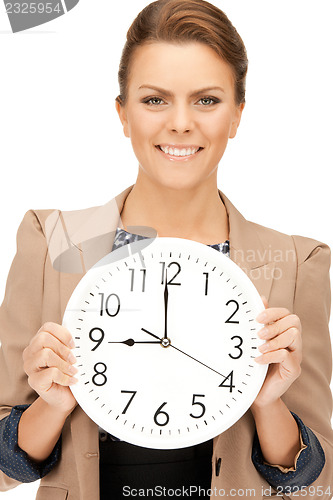 Image of woman holding big clock