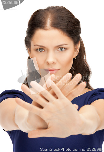 Image of woman making stop gesture