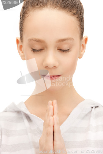 Image of praying teenage girl