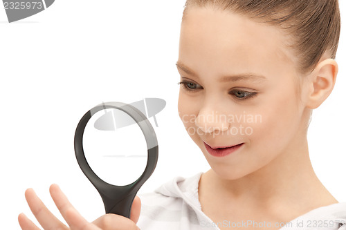 Image of teenage girl with magnifying glass