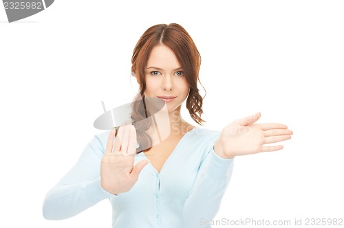 Image of businesswoman working with something imaginary