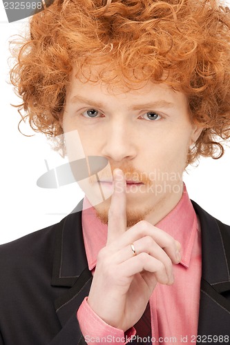 Image of finger on lips