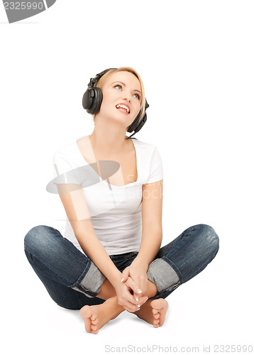 Image of  happy teenage girl in big headphones