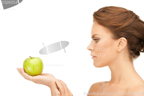 Image of young beautiful woman with green apple