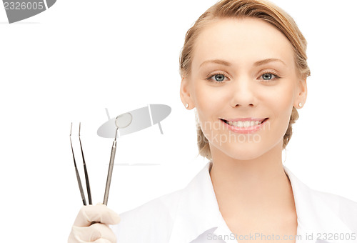 Image of dentist with tools