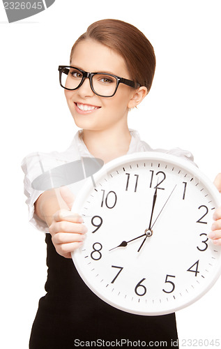Image of woman holding big clock