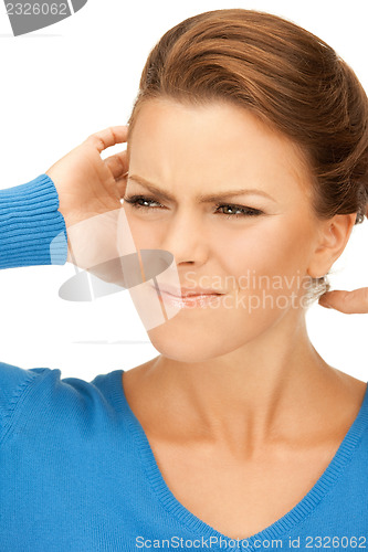 Image of woman with hands on ears