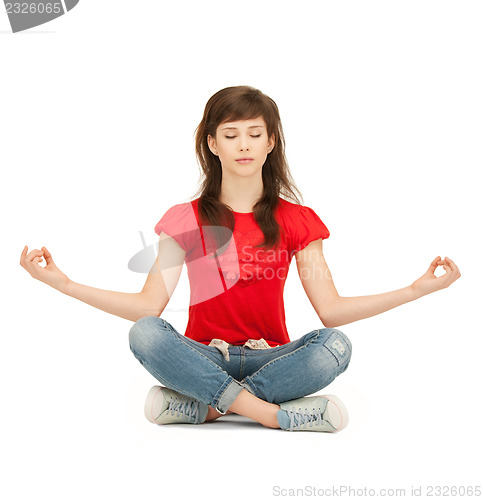Image of calm attractive teenage girl in lotus pose